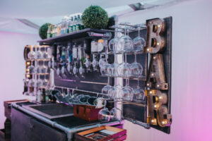 Gin bar for parties stocked with bottles and glasses