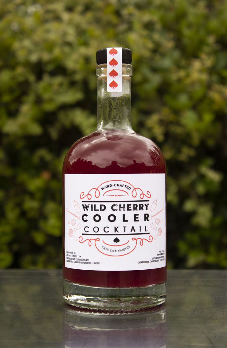 Bottle of pre-mixed Wild Cherry Cooler cocktail on bar top